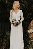 This dress is absolutely beautiful!! I wore it for my wedding and received so many complements :)
The dress was much too long as were the sleeves. The sleeves were very baggy too. I had the dress altered and after the adjustments were made it was the wedding dress of my dreams - Julie C.
