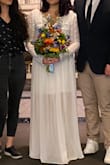This dress is soooo comfortable! A little loose for my in the chest area, but otherwise a great fit and true to size. I shortened the underskirt to make it a mini and kept the chiffon layer long. Felt so great at my courthouse ceremony and will be rewearing this towards the end of the night at the reception this weekend. Love, love, loooove!
Note: the liner is relatively see through, so I recommend a half slip. - Ting T.