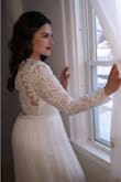 God bless Lulus and their team for this comfortable, beautiful, well priced dress. The only fault this beauty has is that it is a littleeeee larger, mainly the sleeves. I went with a large! The sleeves on my body were long, but nothing we couldn't alter before the big day! We also shortened the length. To give you an idea, I am 5'6" and I was wearing 4 1/2" heels that day (not wearing in pictures provided), so we decided to trim just a little off the length so I could comfortably walk (I'm C L U M S Y). I received many many compliments on the dress and I felt gorgeous!! I was able to dance with my family, sit, walk, and use the bathroom (without help), comfortably all day long! What I loved most about this dress is that everyone accessorized and altered their dress to their preferences and each one looked lovely. I used this as a wedding dress in the winter but It is light enough for all seasons! Love it, love it, love it!! - Fatija S.