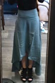 I'm usually either a S or XS. After reading the reviews, I ordered an XS. I think that was the perfect fit. It just looks a little bulky on my lower belly, but it's not - weird fabric or something. Might be better with a crop top instead of bodysuit. Photos are right out of the bag, so definitely needs a steam, but I love it! I'm short, athletic build, and the length is perfect with heels. - Sofia S.