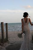This dress is an absolute gem, its beautiful, elegant, and classy. So flattering, I received so many compliments on my wedding day. If you've been thinking of what to get this one will not disappoint. Minor alterations were done but other than that this dress really made my wedding!! - Shanel O.