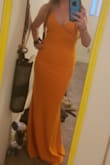 I am normally between a small and medium depending on the brand. I ordered the medium and it worked but was loose and not very flattering. Exchanged it for a small and WOW! Fit perfectly and was so flattering. It is really comfortable material too! A few snags on the material when I got it, so not sure if will snag easily when I wear it (it will be a bridesmaids dress). Might try to exchange for a new one with no damage. Other than that, a super flattering and comfortable dress that's well sized! - Rita K.