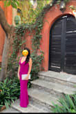 This is my first time writing a review. I bought this dress for a formal outdoor wedding and received tons of compliments. I chose the magenta color and it was perfect for my olive skin tone and dark hair. It fits like a glove, yet was great for dancing into the early hours of the morning. I did have to have it hemmed as it is very long and I am height challenged. Knocking off 1 star because the neckline kept shifting towards one side (even with sitting) and I had to adjust it throughout the night. Overall great dress for the price and I would buy in another color. - Lesa Q.
