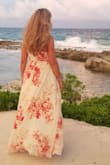 I help my clients with their destination weddings and this dress was absolutely perfect in so many ways. The fit is perfect since this is a true wrap around dress, so it's very forgiving if you gained a few pounds.  The material is light and when you walk or the wind blows, it flows out as though you are on a cloud. It's absolutely a head turner and you are sure to get a lot of compliments. Trying to stay cool when at an outside event is challenging but this dress kept me comfortable even through the outside reception with lots of dancing. I honestly can't imagine any body shape looking bad in this dress! - Tammey P.