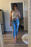 This is by far my favorite spring/summer tank. I've worn it so many times and it washes so well! It's a great length for high waisted shorts/jeans. Try tying the front in a knot for a little bit of a different look! - Emily B.