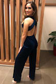 In pictures, the color of the jumpsuit is misleading. It is indeed teal, but had more hints of blue than green which I wasn't expecting. I wore this to my best friend's wedding rehearsal dinner and bought the heels and accessories before seeing the jumpsuit in person, don't make the same mistake! Overall I wish the material could have fit a bit tighter, but the jumpsuit was flattering, comfortable and beautiful nonetheless! - Celine P.
