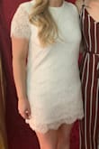 Ordered a medium at first but was too baggy so exchanged for a small! I really like it and thought it fit great. It was perfect for my engagement party. - Chelsea A.
