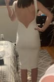 I bought this dress for my rehearsal dinner and can't wait to wear it! The material is thick and good quality and definitely has a little bit of stretch to it, which I like. I especially love the back! - Hollie D.