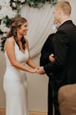 I LOVED this dress! I ordered a small and medium. I decided to go with the small because the MD was a little too big around my bust area. I definitely had to wear spanx underneath, but overall it was the most perfect wedding dress for my courthouse wedding! - Corinne R.