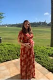 Choose this dress for my maternity photo shoot, I was 26 weeks pregnant for the shoot, I bought a Large and it fit perfectly and flattering over my bump. I have gained 20 lbs so far and the dress made me feel good at about myself and overall pretty and not as pregnant and large as I feel inside! Dress is a bit long but I wore sandals because I can't wear heels right now but it was perfect for my shoot, I felt beautiful and flattered all the right places and dress is forgiving! I feel like the dress is something I can wear post pregnancy and breast feeding friendly! - Ashley H.