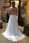 The dress fits me like a dream. All the Small details are absolutely beautiful! I couldn't be happier with it! - Nicala D.