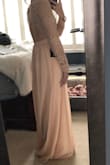 This dress is beautiful. I will wear it on my wedding day. It is exactly what I hoped it would be. It did have an odd odor when I got it but was going to the dry cleaner for wrinkle removal anyways. I did not have a smell after dry cleaning. - Kayla B.