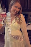 I bought this dress for my bridal shower and it was perfect! I will say, I was expecting a true white and it is a little more cream/off white, but still cute. I was also worried about the deep cut, but with a bralette I felt very comfortable. The skirt is a little see through, but wearing nude spandex/underwear should do the trick just fine. - Lauren B.