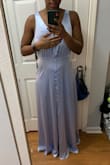 I have an athletic build and fluctuate between medium and large. I originally ordered a large in this dress and it was way too big as seen in the second photo so I went ahead and ordered the medium and it fit perfectly. I do have heels on in the second photo that are about 3 inches high. Overall the dress is long and I'm pretty tall so shorter girls would need taller heels or alterations. I'd go with a size down than what you normally order for the best fit though. This is a really nice dress and I got several compliments! - Malikah M.