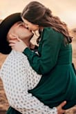 This dress is so beautiful! I wore it for my engagement photos and it was perfect. I loved that it is a wrap dress so it fit perfectly. It definitely shows some cleavage but in a good way! - Loren C.