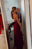 I got this dress for a potential military ball in the plum color. The photos that I took have an edit over them making the dress look a bit redder but it is definitely purple (plum) color. It is NOT burgundy. The dress fits well. It has adjustable straps to help the backside. I'll probably wear nipple pedals with it or sticky cups tbh. It is not padded. It is a simple and classic dress. I am a 32A, with a 27-inch waist and a 35-inch hip. I am 120 pounds and usually an xs or small in everything and the xs worked perfectly with some heels. - Kyla S.