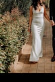 Loved this dress! I had it hemmed and then had the adjustable straps removed, runs a little big but made it work! It's so simple, yet still so stunning. We had a city hall wedding, but had photos taken at a green house and it photographed well! It's a thicker material so you don't have to worry to much about what's underneath, I opted for petal covers! - Allison S.