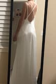 I bought this with no reviews on it yet (I love reading the reviews and seeing photos to get an idea of how it will look ahead of spending the money) but I'm so happy I did. It's beautiful quality, not too thin and doesn't show anything underneath it. Love the silky feel and so happy with the purchase. My one complaint would be that the straps will probably need to be shortened about 1/2 an inch, but it really is so stunning and the price point is amazing. In the photos it still is a little wrinkly from being shipped in the bag but once it's correctly steamed and relaxed it is going to be stunning! - Hailey G.