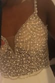 The dress was exactly as pictured, but 10 times better in person. I don't really like to order things online because I like to feel and see items in person. The detail on the top of this dress is what I was looking for at the price that I wanted to spend for our elopement. I couldn't be happier! - Br L.