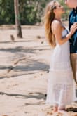 Wore this dress for my engagement photos and it was beautiful! It hit me at ankle length and fit wonderfully. I'm a 32 B and the dress was a bit snug up top so I would recommend sizing up if you are larger chested. The detailing in the skirt is delicate and beautiful! - Rosa P.