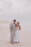 I had a beach wedding and was looking for an elegant dress that would be appropriate for the beach. We had a destination wedding in Punta Cana and was also traveling with the dress out of the country. I had the length altered and switched the original cups to bigger nude cups. The dress photographed beautifully! You can't beat the price for a wedding dress. I received so many compliments and they were all asking where I bought the dress! - Karolina V.