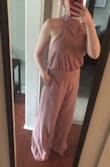 Absolutely love this jumpsuit and the way it looks on me. Was worried when I ordered it that it would zip but it's perfect! A little long at the bottom but will be wearing heals for my sisters bridal shower so will be fine for me. If purchased might need to get hemmed but other then that it's absolutely perfect! - Emily E.