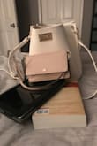 I bought this as a carry on bag for the airplane hoping it would fit my iPad, large reading book, clutch with all the essentials in it, and chargers. Everything fit perfectly, plus maybe a few snacks. The width was just perfect to slip an iPad in without much wiggle room and the bag is not oversized, which I love!! - Angel R.