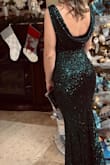 I wore this dress to my work holiday party and I got so many compliments! I decided to go with green instead of red (like everyone tends to wear). I ordered an XS and I will be honest, it was a little tight but it all worked out! I wore a black strapless bra but I had to have my friend check that it wasn't sticking out on the backside the entire night so maybe sticky silicone cups would've worked better! Still loved this dress nonetheless. - Paula V.