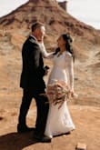 We eloped in Moab and this dress was perfect. I had a seamstress hem the bottom and tighten the bust for me for $100. It really made the dress work.
(Photo credit. Amy Bluestar) - Rayana A.