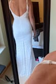 It is definitely right on the brink of possible wanting to size up but I put this on at the end of the day when Im usually the most bloated and it still zips up. I love this because I have broad athletic shoulders and back and this did not make me feel that way at all. So pretty!!! - Lauren B.