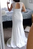 This dress is beautiful, just like it shows on the website! My budget was a lot higher, and I went to many bridal stores. In the end I loved the Lulus dresses the best! The style is extremely comfortable - you could even wear a strapless bra if you like to add some padding. It runs a bit large and it has a stretchy material. I would definitely exchange for an XS for myself. The skirt has a lovely mermaid shape, which shows off your hips but still lets you move around comfortably. The color is a true white. It would be just perfect with a rhinestone belt. I was almost gonna choose this one, but I went with another Lulus dress since I loved the styles with nude underlay and white lace. - Ayca C.