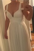 I wore this for my casual beach wedding. The material is really light and pretty. I usually struggle to find dresses that are supportive enough to go without a bra, this dress definitely has support. The medium probably would have fit my bust better (felt like I was spilling out a little), however waist fit perfectly. I had about 3 inches taken off the bottom, and used the length to add extra rouching to the bust for slightly more coverage. Picture below is before alterations. - Catherine B.