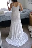This will be my wedding dress!! I was looking for a dress with the budget of $600. I tried so many more expensive dresses and did not like them. I decided to try ordering a few dresses from Lulus. Every single dress I tried from this shop was much better than the ones I tried in local stores! And the price for this style and quality is incredible!! I am amazed with the gorgeous combination of the white lace and the nude underlay. It compliments my skin tone beautifully. Either the back or the front is too revealing, so I could wear a padded bra underneath. I was considering a dress with no train until I tried this one on... It is just amazing. The most beautiful train I have ever seen! The fabric is not stretchy in this one. So the small size worked well since I have a pear shape. I will need to get the length, waist and the bust altered a little. Only thing I would wanna change would be adding some details to the straps. Can't wait to wear this on my special day!!! - Ayca C.