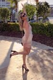 I love how classy the dress looks when it's on. When it was delivered, I thought it would be too small on me but it ended up being so comfy and true to size! The bottom of the dress does rise up a little bit so sometimes I would have to pull it down but it wasn't a huge problem. Totally recommend! :) - Nicole H.