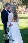 My Wedding Dress was everything I wanted in a dress. Loved how it was sweet and modest while having a beautiful open back and the lace detailing is stunning. Had to do some minor alterations to make it fit perfectly but I loved it. - Shyanne M.