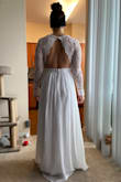 I had to postpone my April destination wedding til December due to COVID-19. I had a gorgeous dress ready. We decided to still have a ceremony and reception in December but will still be exchanging our vows in April since we had the license and we waited long enough. Got this to elope. I'm in between sizes so I have two dresses in a small from Lulus and had to get a medium in another. This was very snug where it clips, but the Medium would have probably been too loose around my bust since I can't wear a real bra. It's very long on me as well since I have a longer torso and shorter legs. I am having it hemmed and adding a half inch to where it clips so it is more comfortable. It's beautiful and I can't wait to wear it in a couple weeks! When I tried it on my fiancé couldn't stop smiling! - Jessica S.