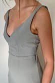 The dress is well form fitted around my waist and hips, but is looser up top; I do have a shorter torso and a smaller bust, but for an extra small I did expect it to fit my upper torso at least a little bit more.
I'm wearing this as a bridesmaids dress in my brother's wedding, so I knew I would need to get alterations anyway. I will be getting it shortened (as with 3" heels, it is still long), and the chest and straps brought in.
The dress is a beautiful color, true to the color shown.
The fabric is lovely and thick. In the center of my chest there is a stitch sticking out, so will get that fixed too.
Overall, very excited and pleased with this purchase! - Kaitlen C.