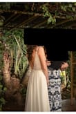 Wore this dress on my wedding. It was a casual event but I felt so special in it. Details are stunning up close too. Had some weight to it, layered well so the bottom it is not see through. Had to get the bottom hemmed to get off the floor a little but no other alterations needed. Fit me perfectly everywhere else. People were shocked and thought I got it professionally tailored. - Heidi G.