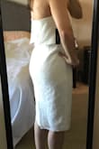 This dress is flattering! It's a little loose, but probably for the best as I'll be wearing it to my shower in front of my aunts, in-laws and Grandma! It hits just below the knee for me. I would like it a little shorter, but again, I could definitely wear it in church with a light sweater. No bra needed and hides all tummy/booty imperfections! - Ashlyn L.