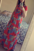 This dress is very comfortable and a great length.  Being on the taller side it is hard to find maxi dresses that go to my ankle. However, there is no issue here with this dress. There is a slit in the side of the dress as well. It goes up above my knee. It made it so I could tie the dress up walk along the water. The color of the dress is also very pretty. It comes across like a bright orange coral. Note: This dress does wrinkle easily so pack it flat. - Kirsten L.