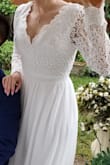 I've had my eye on this dress since I got engaged in 2018 but decided to get a a bigger, more expensive looking dress for my church ceremony. Except that my church wedding had to be rescheduled because of the COVID-19 pandemic! So I decided to buy this dress for the tiny ceremony we had in the backyard and save the other one for when we get married in the church. I couldn't have asked for a better look! It's comfortable and looks amazing in pictures/video. It does fit a little big though. I ordered a small and wish I would have ordered an XS. I had to take in the shoulders and tape the low neckline to my chest so it wouldn't show anything. - Sally M.