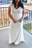 I love this dress. The fabric is soft, thick, and stretchy. It's extremely flattering and comparable to expensive dresses. The zipper is strong and doesn't feel fragile. The color is an ivory/cream not a white.
I would recommend this dress to anyone who is looking for an alternative dress. My only qualm is that I wish the sleeves were a little longer since you can see my bra fat. I prefer the sleeves from their "Undying Love White Lace Short Sleeve Mermaid Maxi Dress" but the fabric and zipper from this dress. - Angelica G.