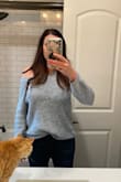 Love this sweater. Very comfortable though it runs large. Mine kept falling off the shoulder but it was actually cute that way. If you want a tighter fit, order a size down for sure. - Christal V.