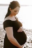 I ordered this dress for maternity photos and I was worried it wouldn't fit because I'm in the 3rd trimester, but it was nice and flowy / stretchy! The waist is high enough to accommodate a big bump! I love the dress. I'm 5'8" and 180 - Shealyn