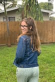 Don't size down! I know a lot of the other reviewers are recommending to size down, but honestly, this jacket is PERFECT as-is. I'm normally a Medium in almost everything, so I stuck with a Medium here and it was great. It's meant to be a bit oversized, but it doesn't look bad, it just looks cute and comfy. You could also take advantage and layer with a long-sleeved thermal or a hoodie in the fall and winter months.
I'm in love! - Lara C.