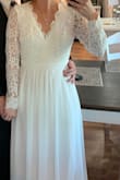 I got this dress for a courthouse wedding because my original wedding day was canceled due to Covid 19. Courthouses were also closed, so my fiancé and I still dressed up and shared our rings. I will wear this dress in October for rehearsal dinner. Super comfortable, very well made, lace was so soft and comfy. Length is long-which nice you may need that tailored if not wearing heels etc. - Breanne B.