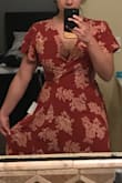 I really like this dress, the color is a dark/burnt orange color. It's a wrap style dress and has an adjustable tie to cinch in the waste. Very light material and its a bit long but I think if I wear a wedge shoe it will work. - Kayla C.