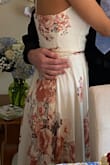 I love this wraparound dress! It's beautiful and I received so many compliments. I used this to celebrate my original wedding date. The dress runs a bit to long even with heels and the button on the dress kept popping open. Even so, I love this dress and can't wait to wear it out for my bridal party in September. - Roselyne R.