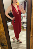I'm one of those taller girls who has a hard time with rompers/pant suits fitting due to length and such but this fit! I actually found it a little loose but I think this is meant to be more of a flowy look anyway. What's awesome about this is the super long straps up top so you can adjust the fit very easily based on how your wrap & tie it! The back is so cute & fun! I have a smaller chest and I wanted a more risky outfit without being overly so and it works ! Can't wait to play around with how to style it & wear it (after a good steam)! :) - Shelby B.