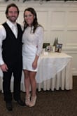 I bought this dress for my bridal shower and ended up wearing it again for my rehearsal dinner. Love this dress! I am a 34DD so I liked that it made me look smaller chested. Only downside is it rides up a bit when you sit down and it is tight on the stomach. - Sarah Z.